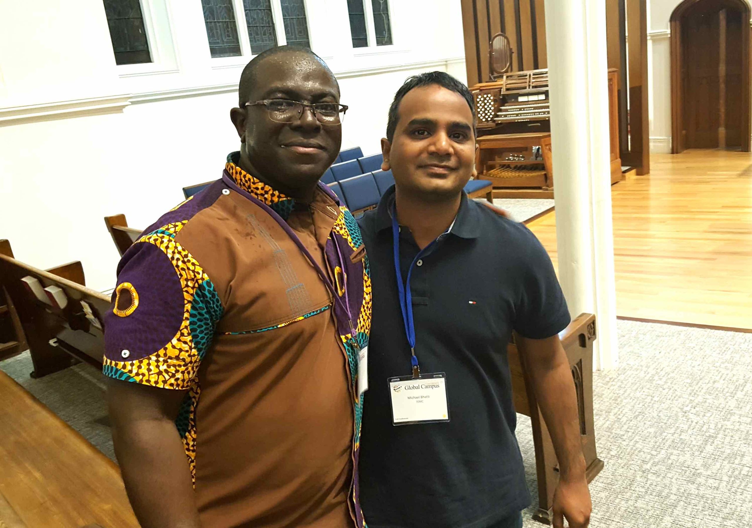 ISMC President Dr. Yaw Perbi introducing Michael Bhatti, from India, at the recent Global Campus conference in Toronto.